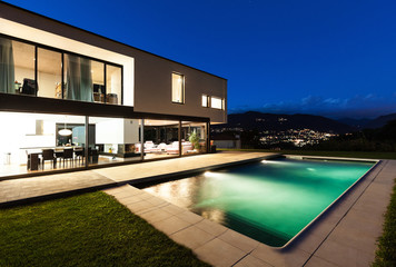 Fototapeta premium Modern villa, night scene,view from poolside