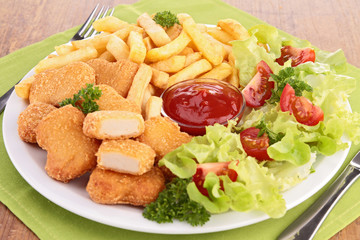 chicken nuggets,french fries and salad
