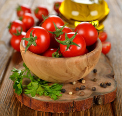 Fresh cherry tomatoes in a wooden bowl