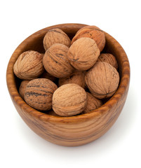 walnut in a wooden bowl