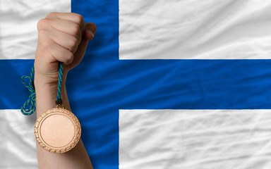 Bronze medal for sport and  national flag of finland