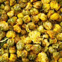 Fototapeta na wymiar Heap of dried chamomile flower