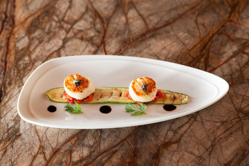 Grilled scallops with zucchini.
