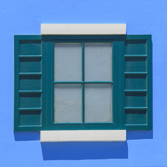 vintage windows on the blue wall