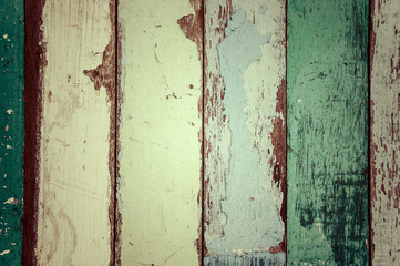 Old vintage colorful paint over wood.
