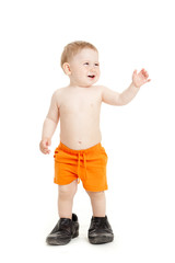 Little baby boy in father's shoes.