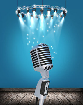 Old fashioned microphone with spotlight on blue empty interior 