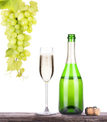 grapes  with bottle of champagne and glass