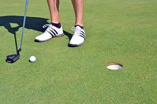 Golf ball golf shoes and stick