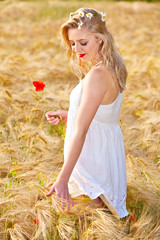 Portrait of beautiful girl in field