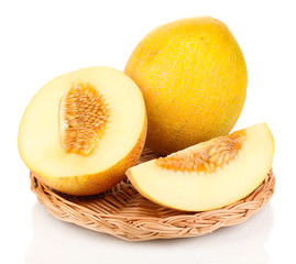 Ripe melons on wicker cradle isolated on white