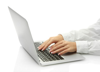 female hands writing on laptot, isolated on white