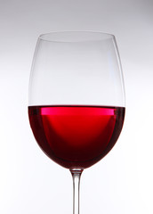 Glass of wine on gray background
