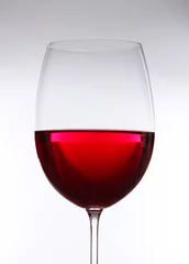 Fotobehang Glass of wine on gray background © Africa Studio
