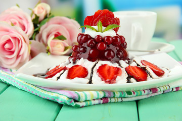 Tasty jelly dessert with fresh berries, on bright background