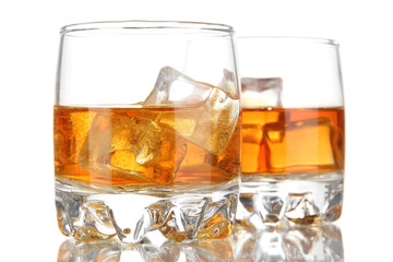 Brandy glasses with ice isolated on white