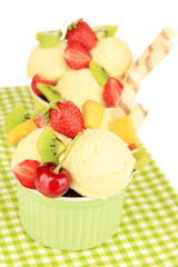 Delicious  ice cream with fruits and berries in bowl close up