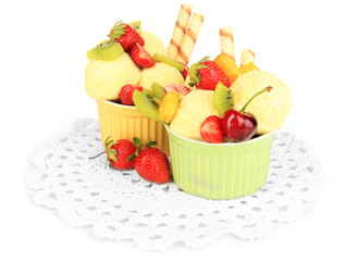 Delicious  ice cream with fruits and berries in bowl isolated