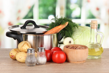Ingredients for cooking borsch on table in kitchen