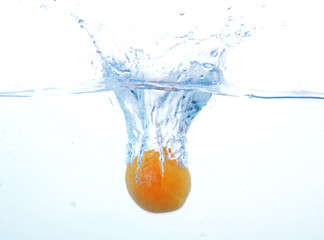 Fototapeta na wymiar Juicy fruit under water, isolated on white