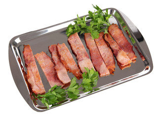 Fried bacon on metal tray isolated on white