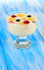 Delicious yogurt with fruit on table close-up