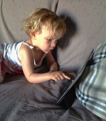 baby girl using tablet