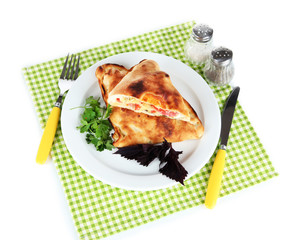 Pizza calzone on table on napkin isolated on white