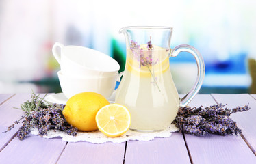 Lavender lemonade, on  violet wooden table, on bright