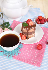 Chocolate cake with strawberry on table close-up