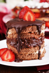 Chocolate cake with strawberry on wooden table close-up