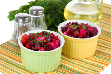 Beet salad in bowls on table close-up