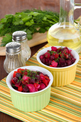 Beet salad in bowls on table close-up