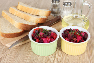 Beet salad in bowls on table close-up