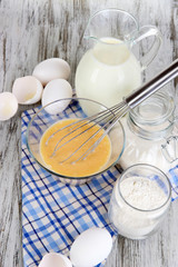 Ingredients for dough on wooden table close-up