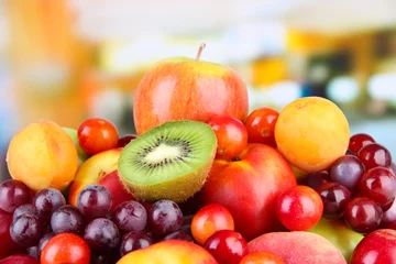 Foto auf Glas Assortment of juicy fruits on bright background © Africa Studio