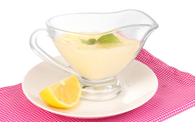 Mayonnaise in bowl on napkin isolated on white