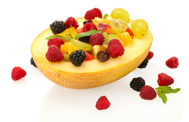 fresh fruits salad in melon  and berries, isolated on white