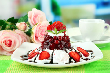 Tasty jelly dessert with fresh berries, on bright background