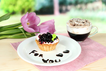 Sweet cake with blackberry and chocolate sauce