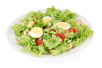 Caesar salad on white plate, isolated on white
