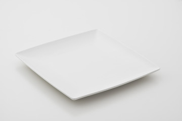 Porcelain plates on white background