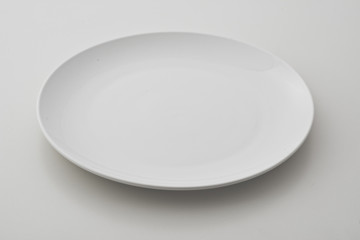 round porcelain plates on white background