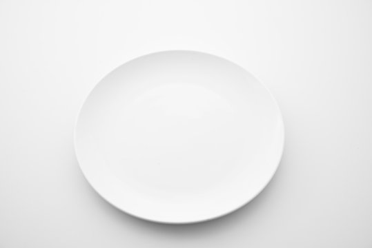 Porcelain plates on white background