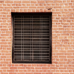 Window and red brick wall