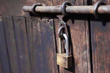 Padlock, close up wood door with metal locked