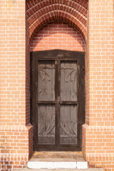 wood door, and brick wall