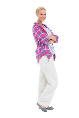 Smiling woman standing with arms crossed