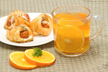 Tea break, orange tea with little  croissant