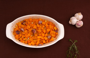 Baked pumpkin with garlic, olive oil and rosemary.